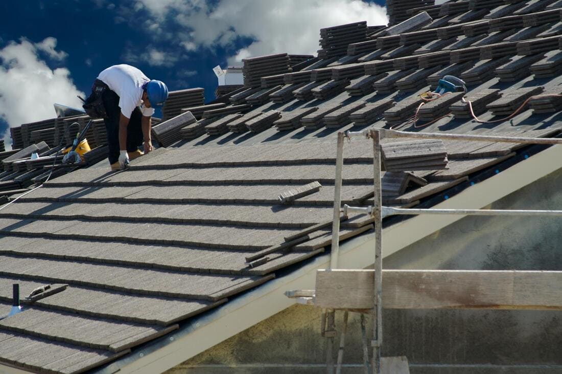 Roofing crew installing roof battens