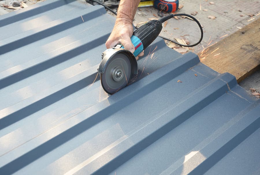 Illustration: ribbed metal roofing panel being cut
